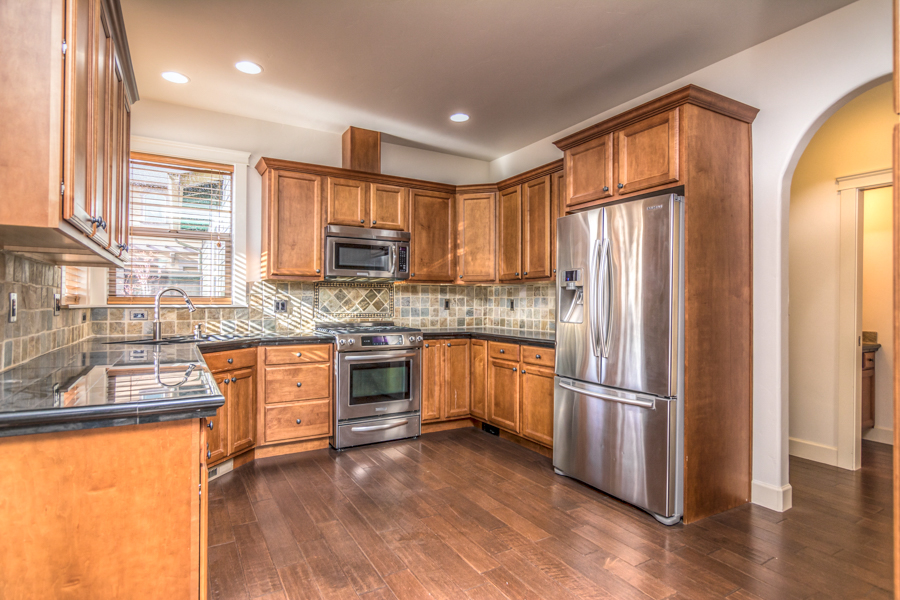 Kitchen with stainless steel appliances in this NE Bend rental near schools