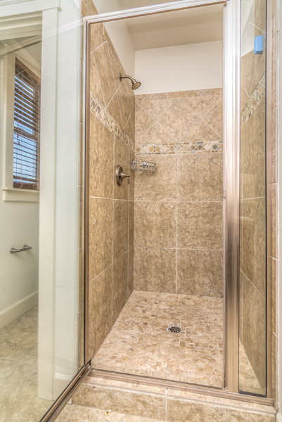 There is a tiled walk in shower in the primary bathroom of this NE Bend rental near schools