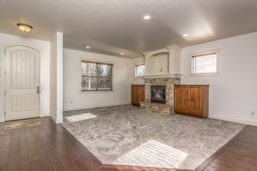 Living room with gas fireplace in this NE Bend rental near schools