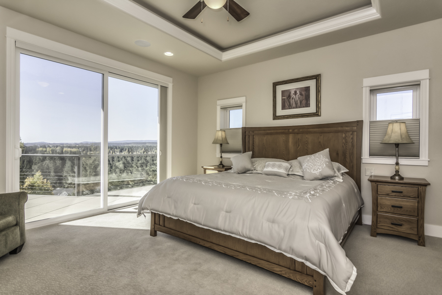 king size bed in the master bedroom of this furnished executive rental