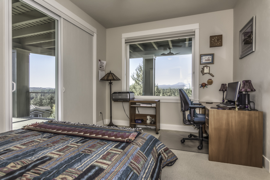 sunrise views from the bedroom of this executive rental in Bend