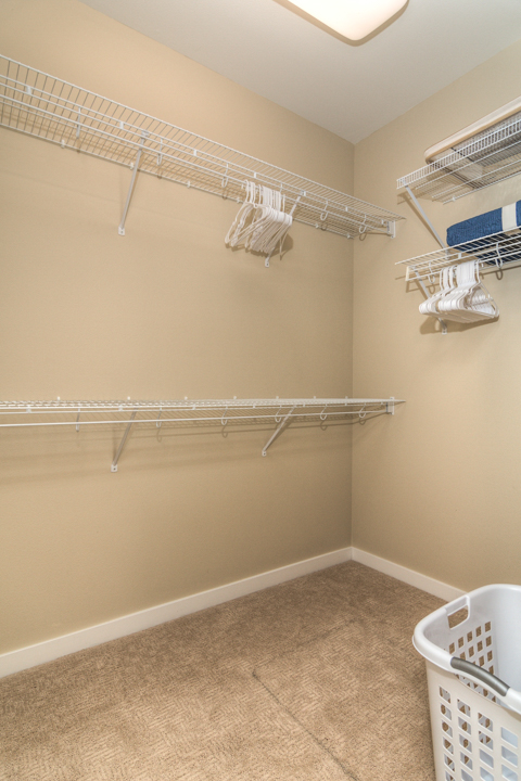 walk in closet of furnished executive rental in Northwest Crossing