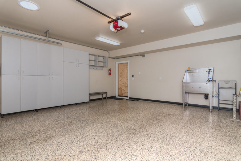 built in cabinets and dog wash station in garage of furnished executive rental in Northwest Crossing