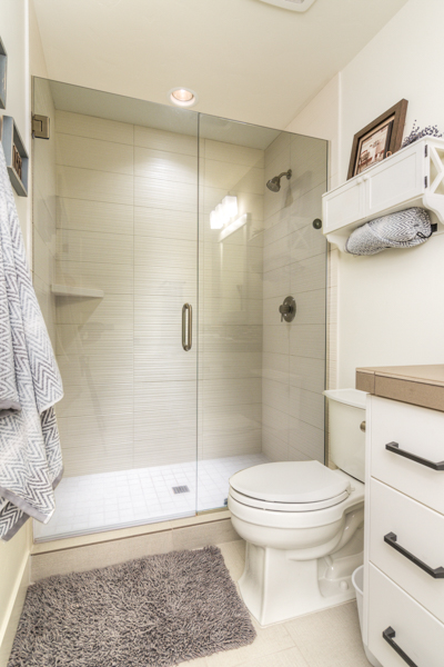 This furnished northwest crossing townhouse has two and a half bathrooms. This one has a tiled walk in shower.