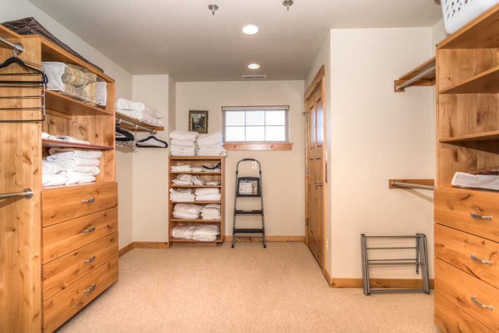 The primary bedroom of this Old Mill River rental has a huge walk in closet