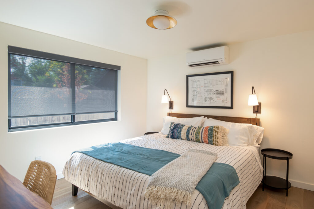 King size bed in the primary bedroom of this Northwest Bend executive rental