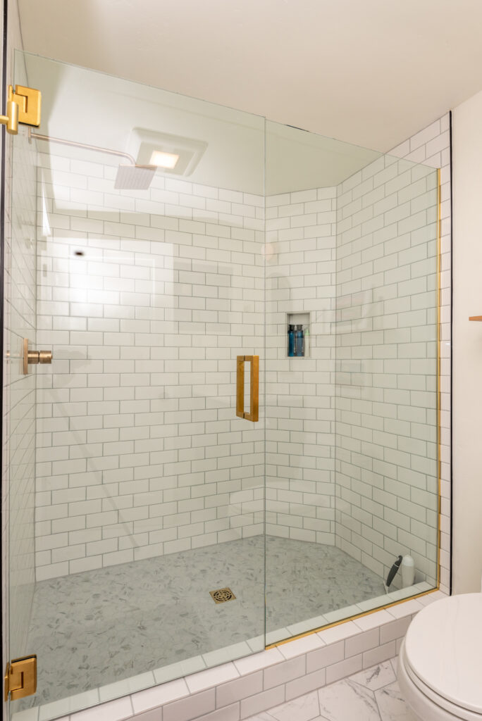 Subway tile in the walk in shower of this Northwest Bend executive rental