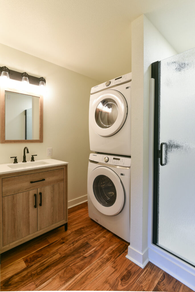 Bathroom with washer and dryer in this one bedroom rental in Midtown