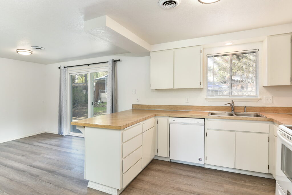 The kitchen of this rental on the south side of Bend has painted white cabinets