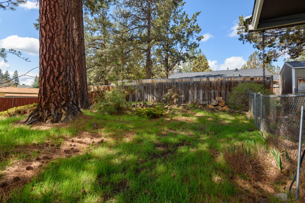 Incredible, large Ponderosa trees can be found in the back yard of this rental on the south side of Bend