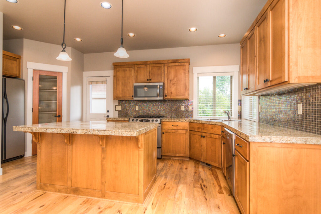 The kitchen of this rental in the Sagewood neighborhood of SW Bend has a breakfast bar.