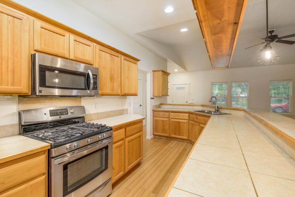 The kitchen of this Redmond Oregon rental has a large amount of cabinet storage