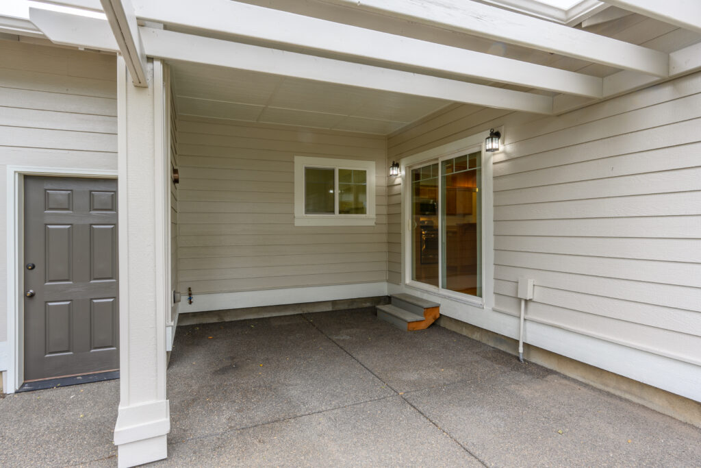 Paved back patio of this Redmond rental