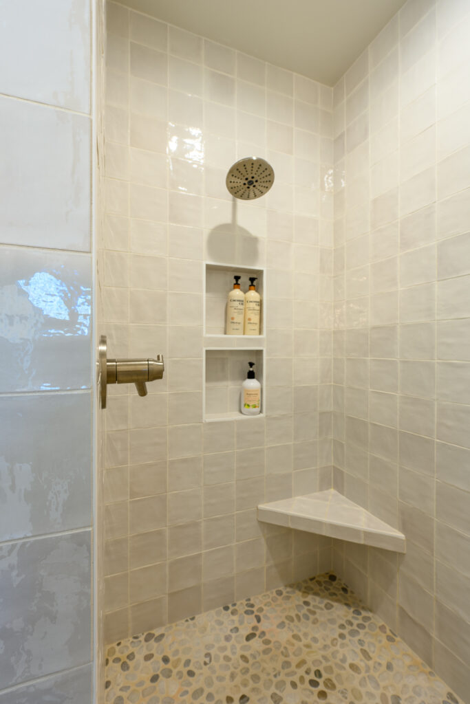 A tiled walk in shower is also included in the primary bathroom of this furnished executive rental.