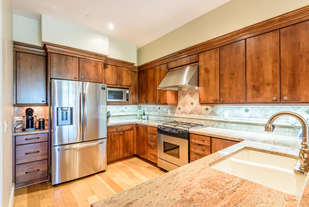 Stainless steel appliances and granite slab counter tops in this Franklin Crossing downtown Bend rental